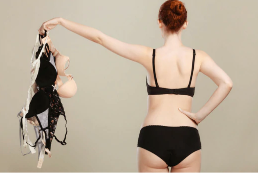 A Faceless Woman Wearing a Blue Bra and Panties Set 